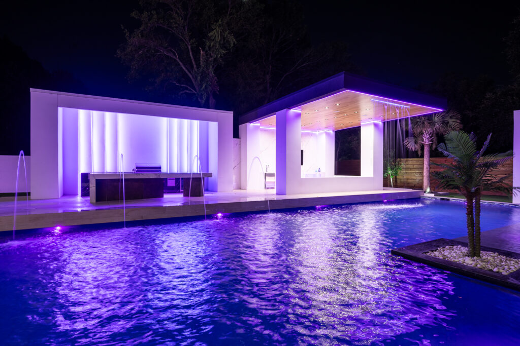 dallas event venue rental backyard pool bar photo vido shoot scene with waterfall and custom led lighting