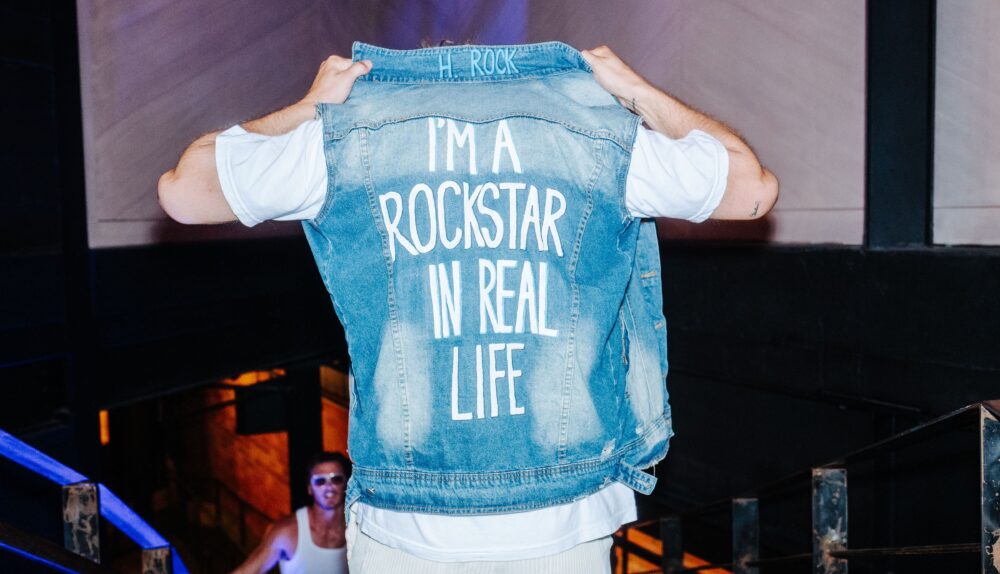 harrison rocke custom jean jacket i am a rock star in real life at swimweek 2024 dallas texas